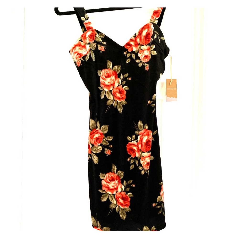 Soft black dress with flower design 
Never worn 
Tags on